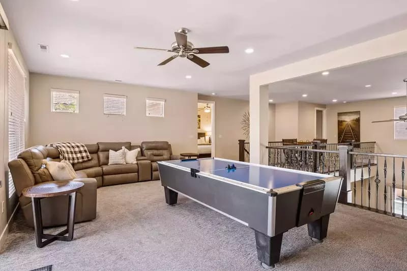 Living room with air hockey table.