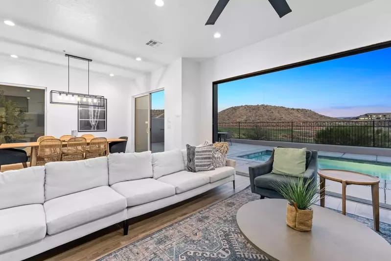 Modern living room with pool view.