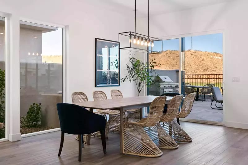 Modern dining area with mountain view.