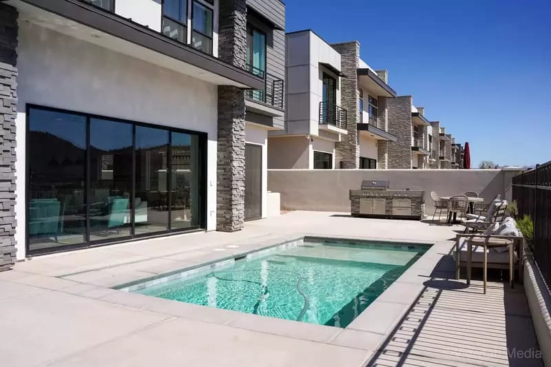 Modern townhouse with a small pool.