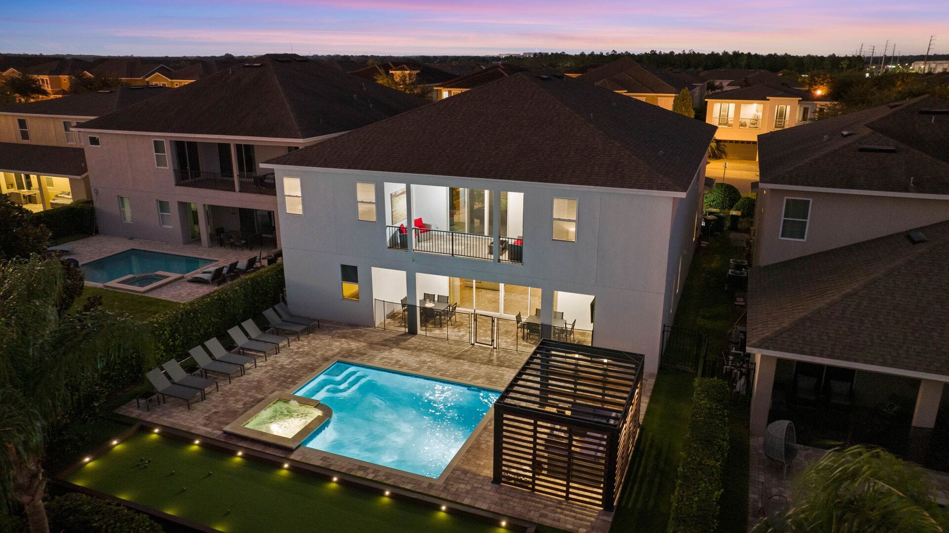 House with pool at dusk.