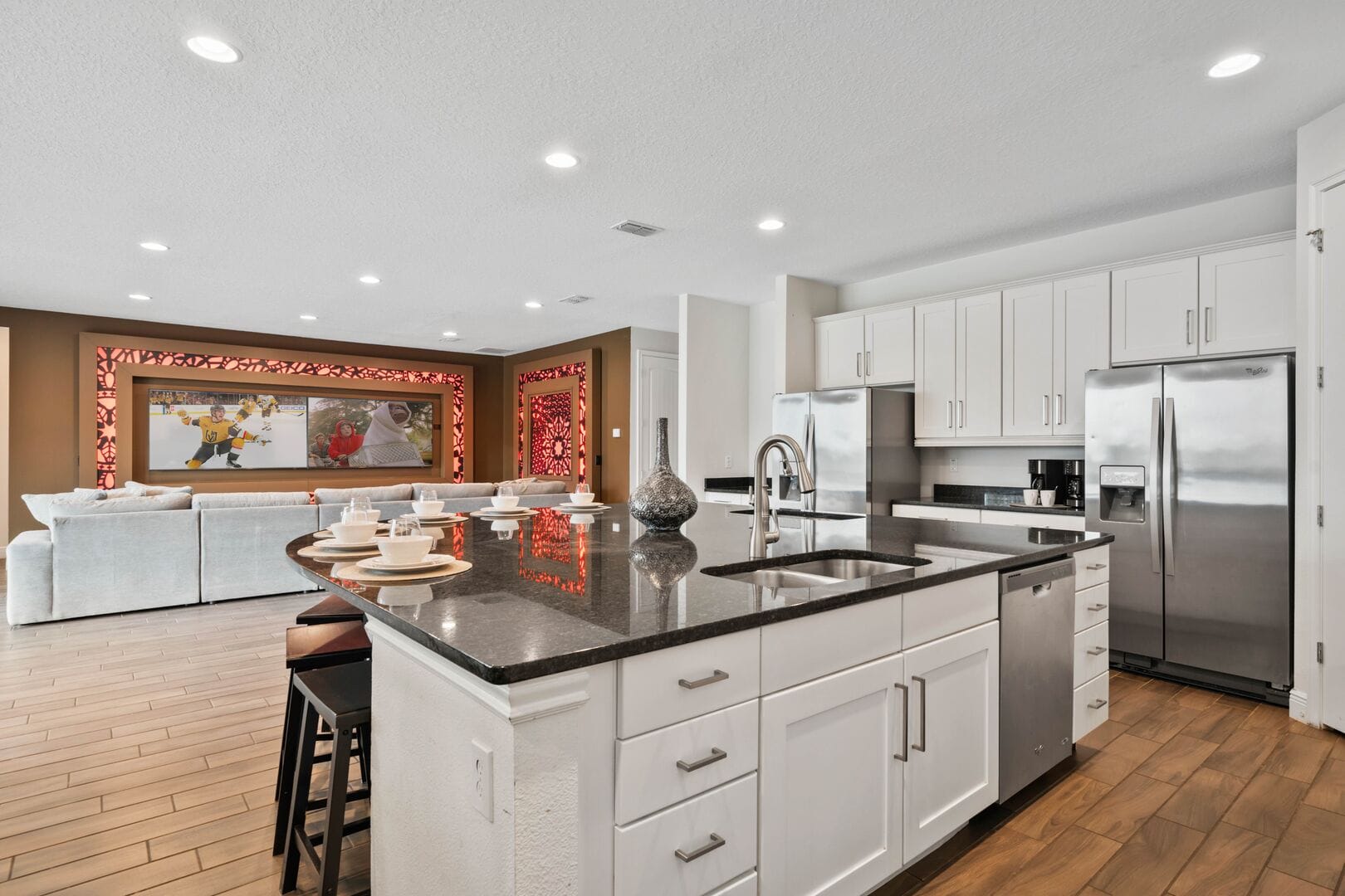 Modern kitchen with island and seating.