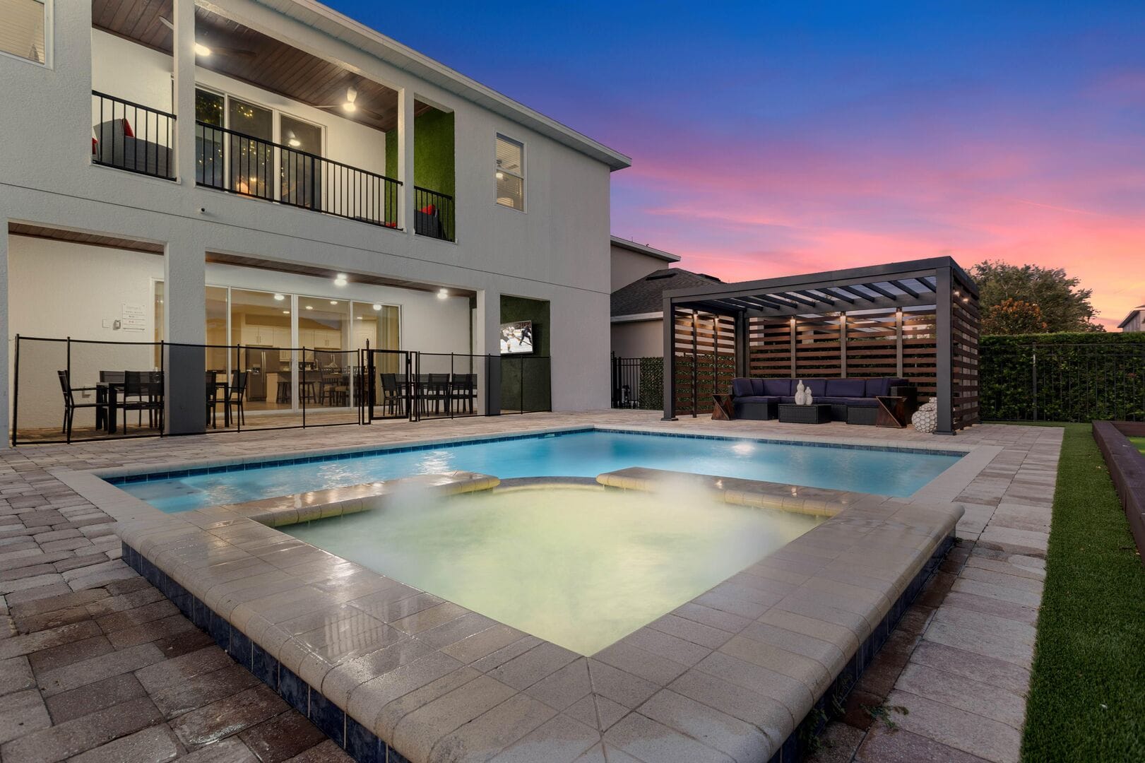 Backyard pool with seating area.