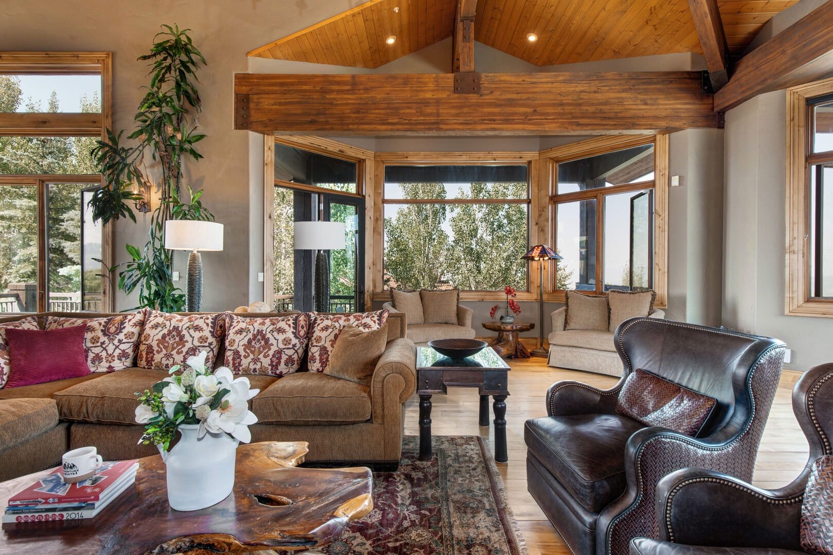 Cozy, rustic living room with windows.