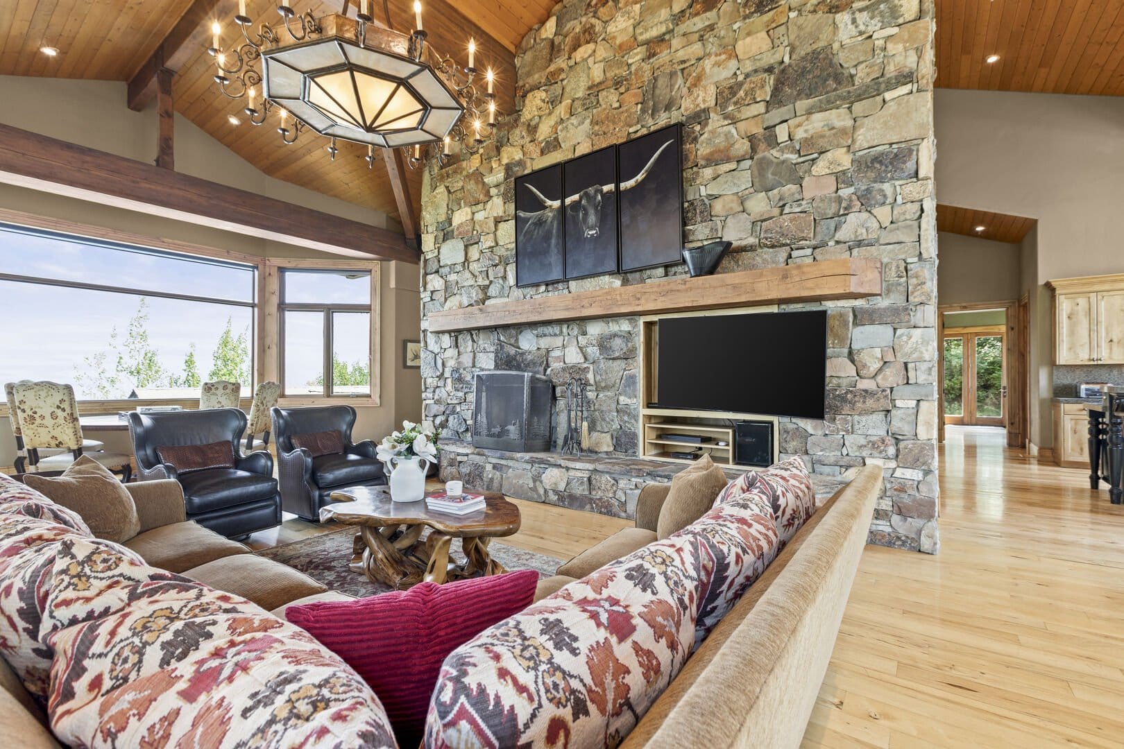 Rustic living room with stone fireplace.