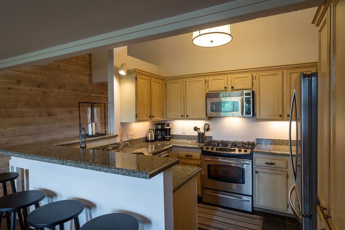 Modern kitchen with granite countertops.