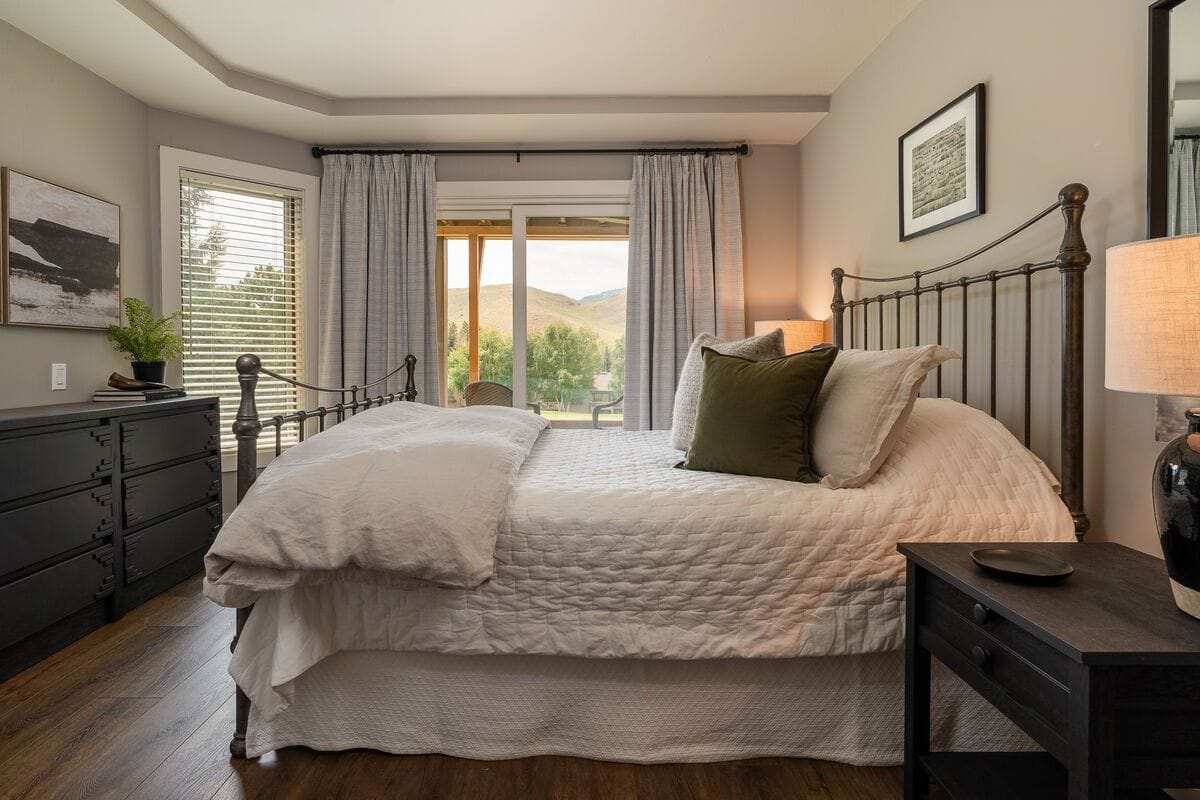 Cozy bedroom with scenic view.