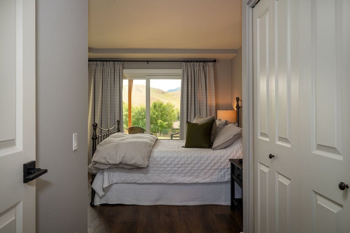 Cozy bedroom with scenic view.