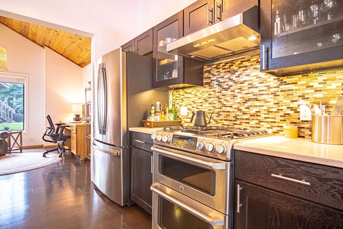 Modern kitchen with wood ceiling.