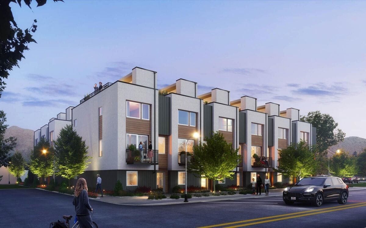 Modern townhouses at dusk.