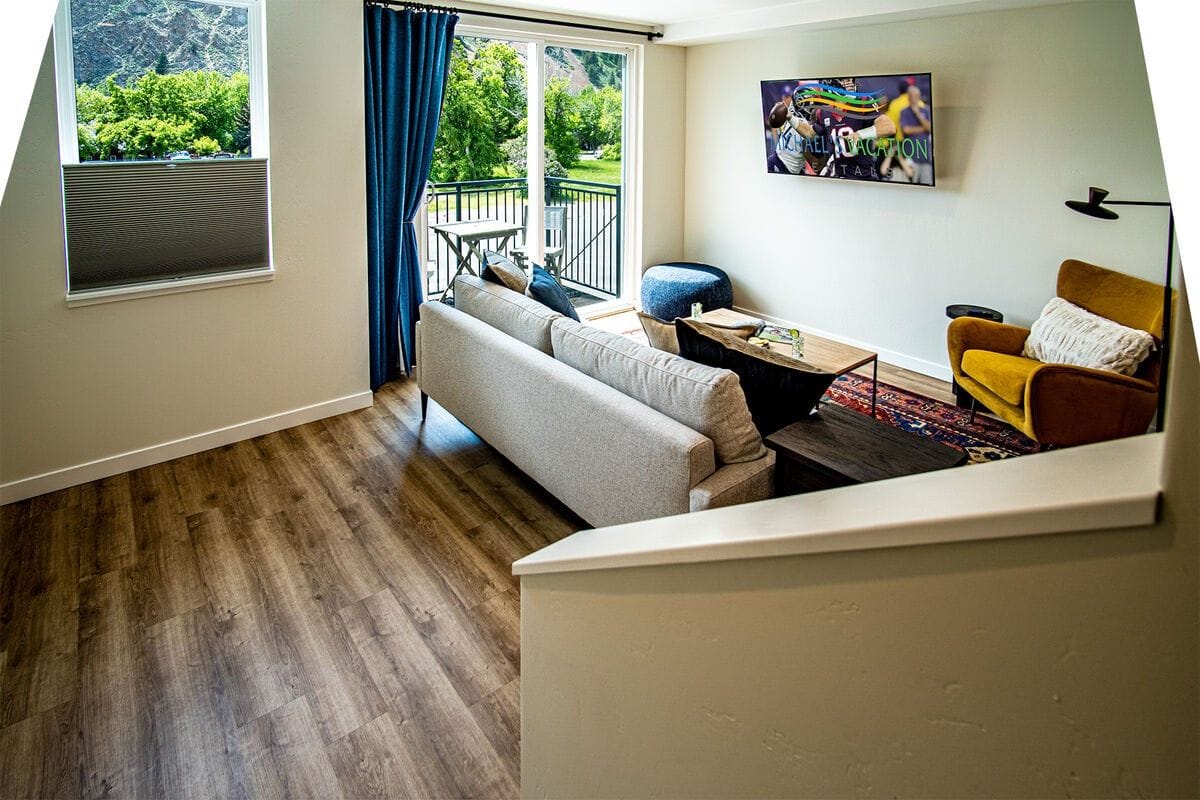 Modern living room with balcony view.