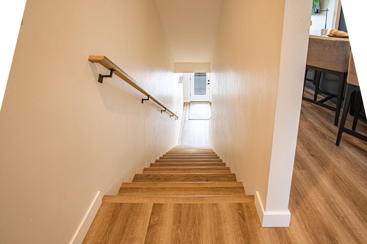 Wooden stairs leading to door.