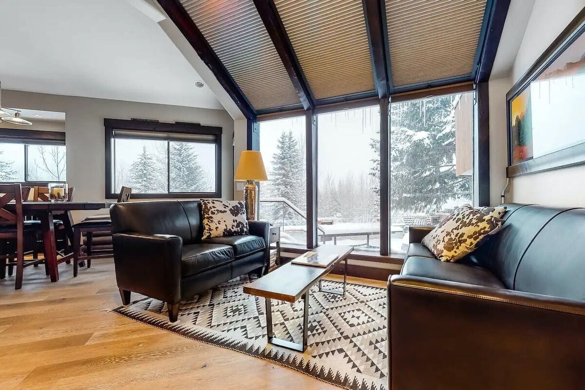 Cozy living room with snowy view.