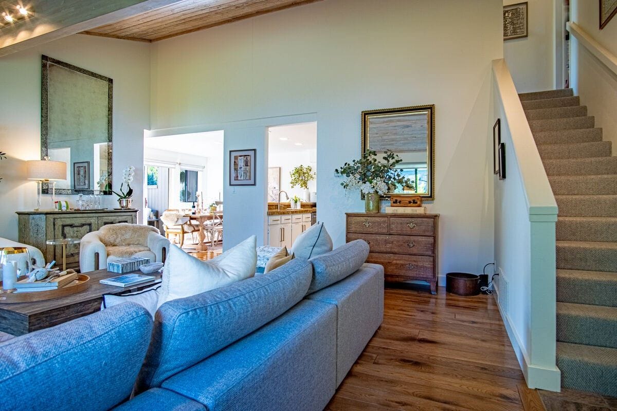 Cozy living room with staircase.