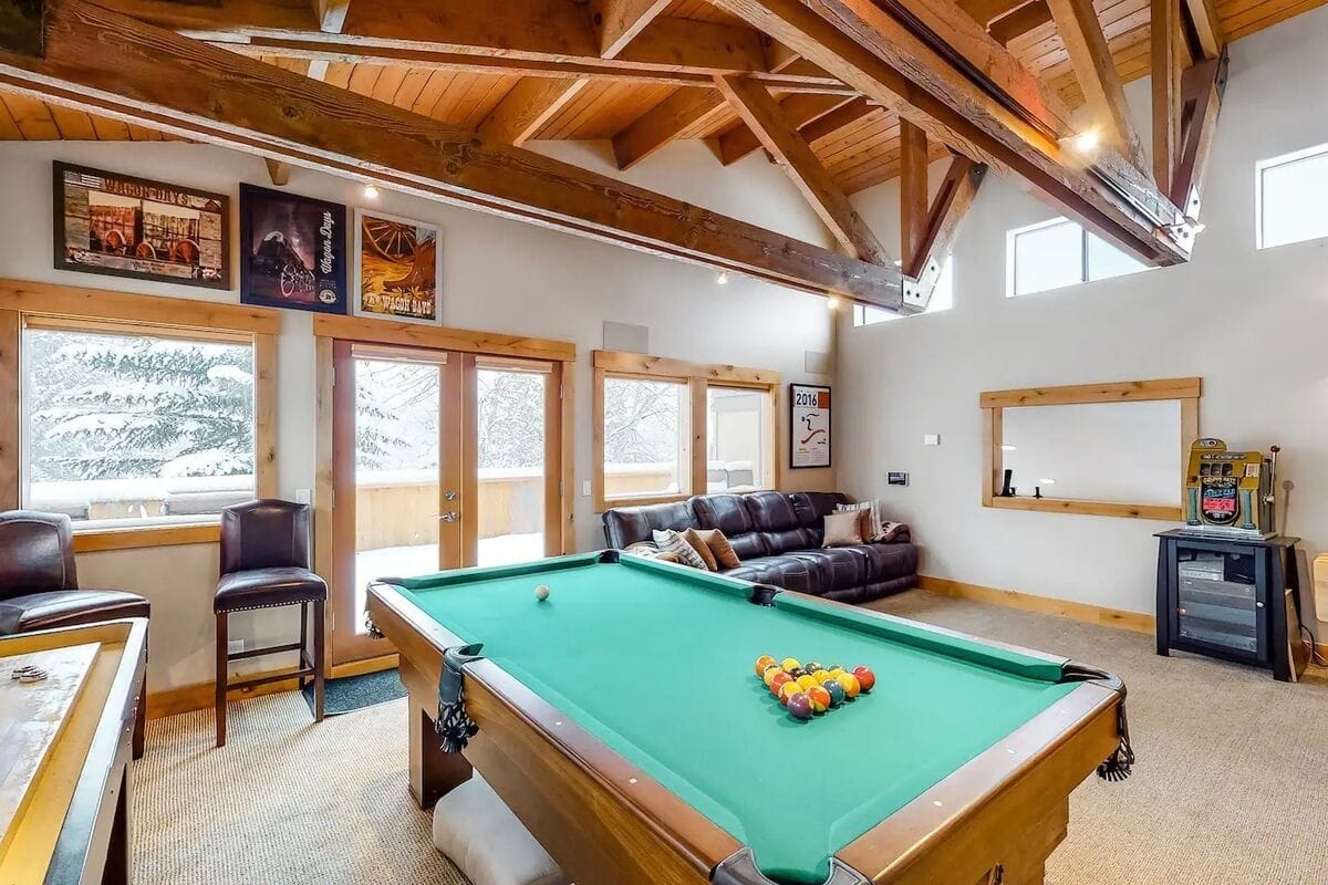 Rustic game room with pool table.