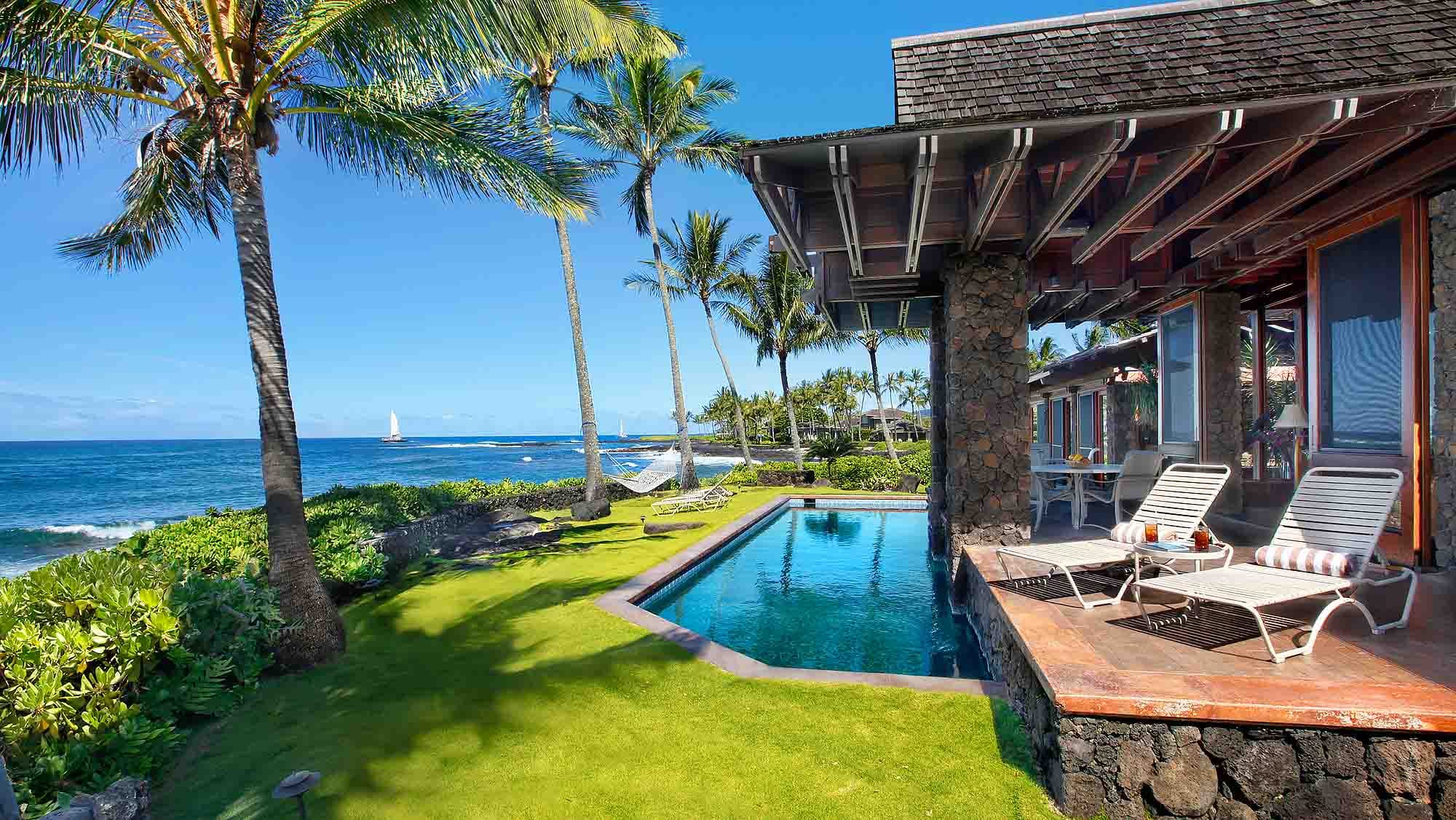 Beachside house with pool and palm