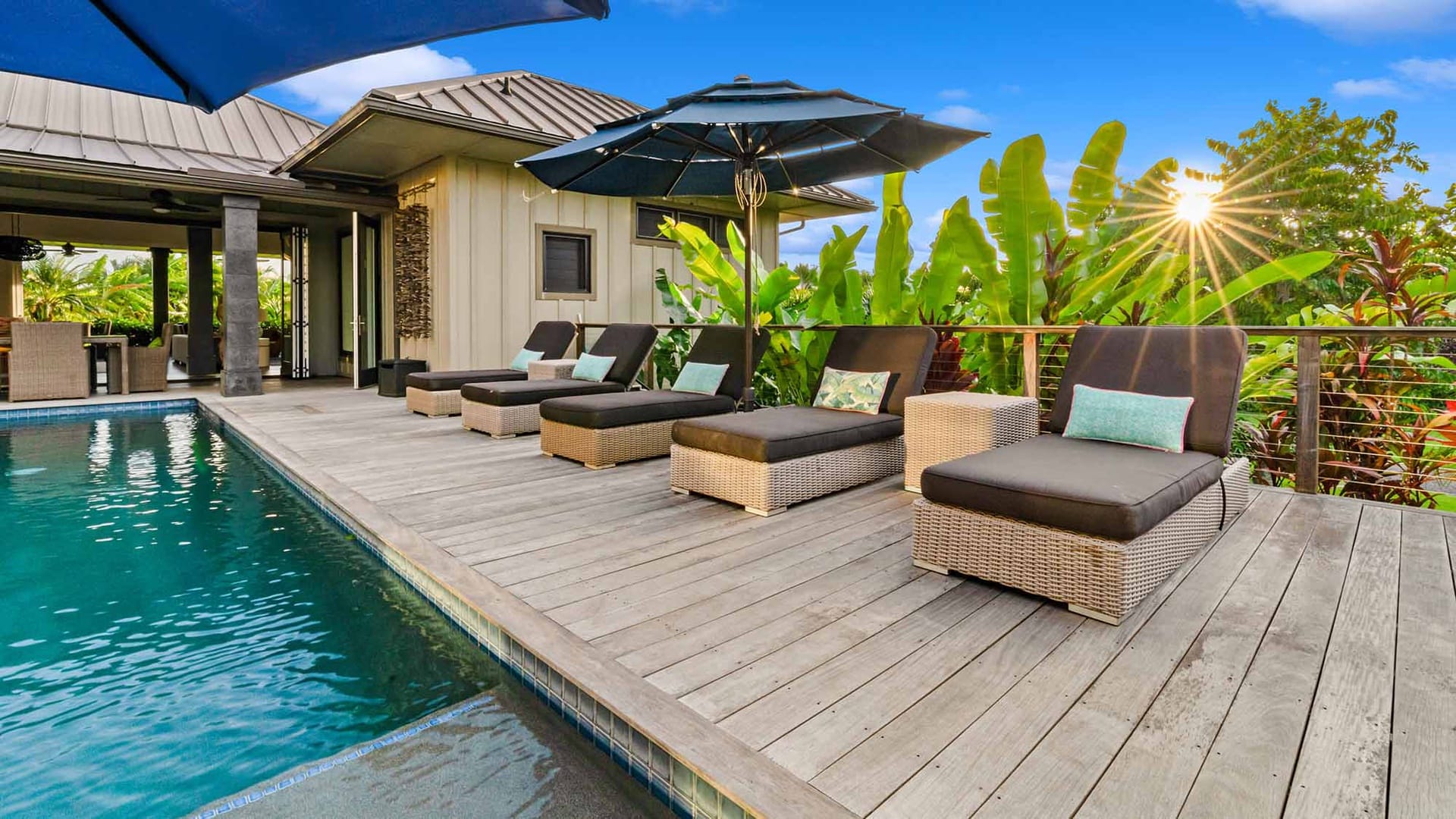 Poolside lounge area with umbrellas