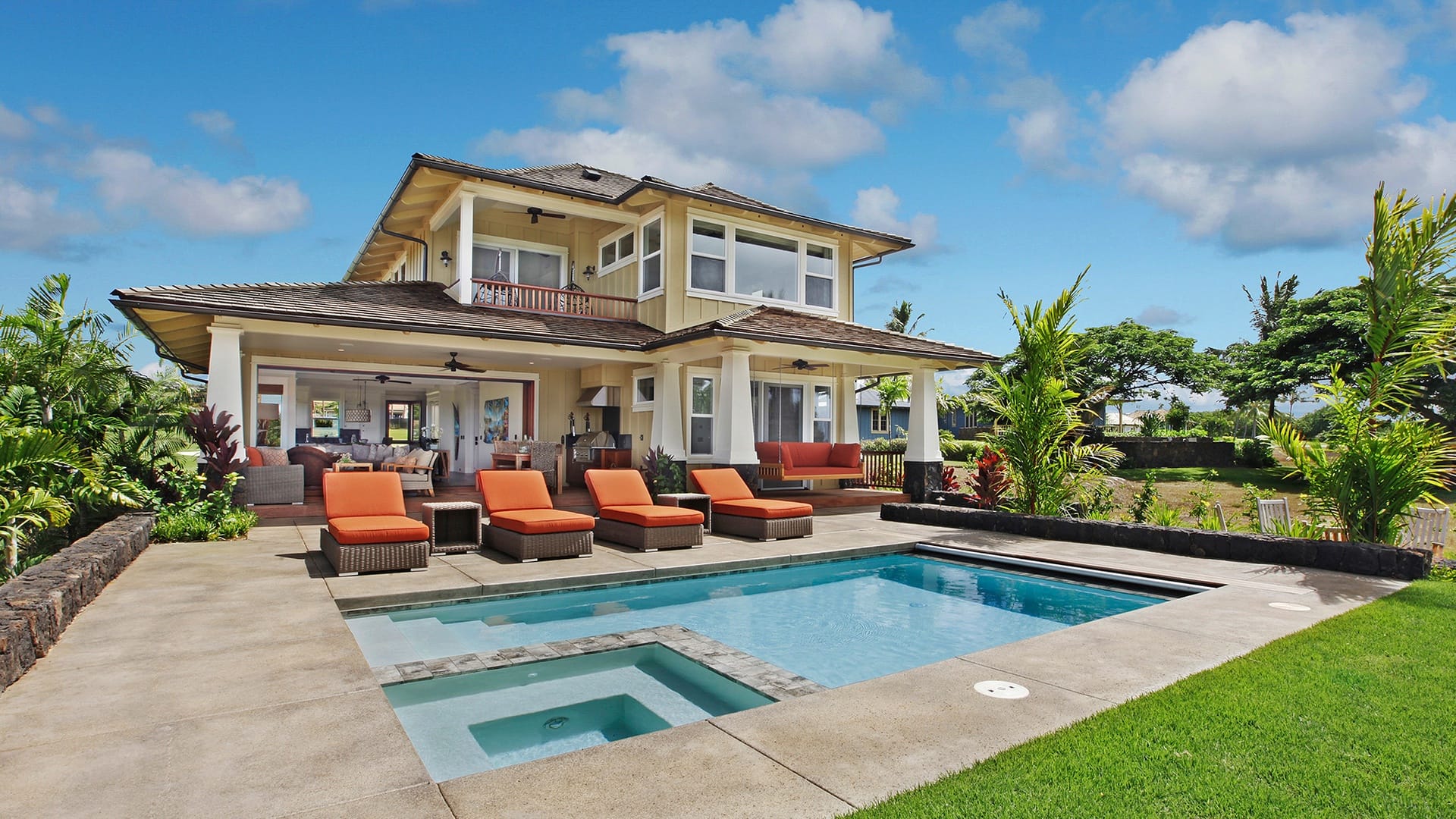 Two-story house with pool.