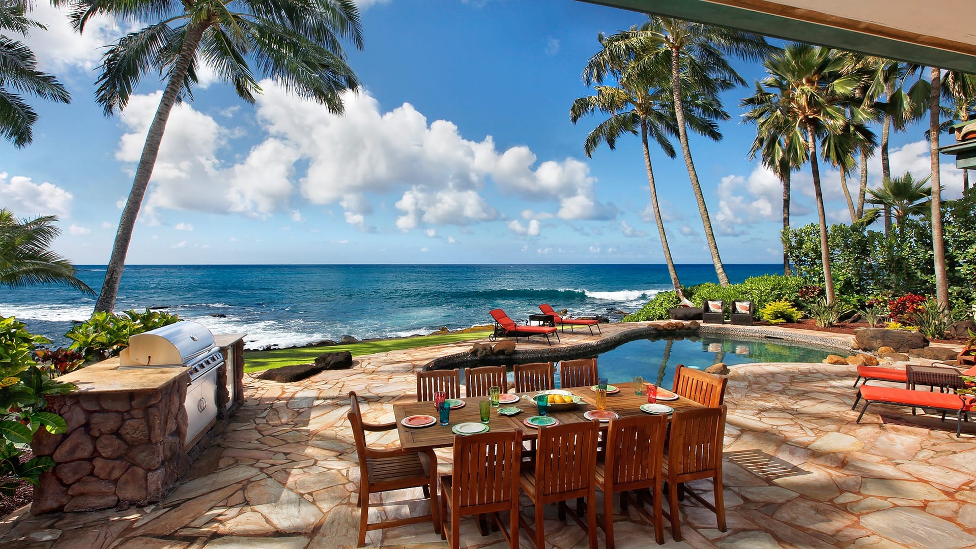 Beachfront patio with dining table.