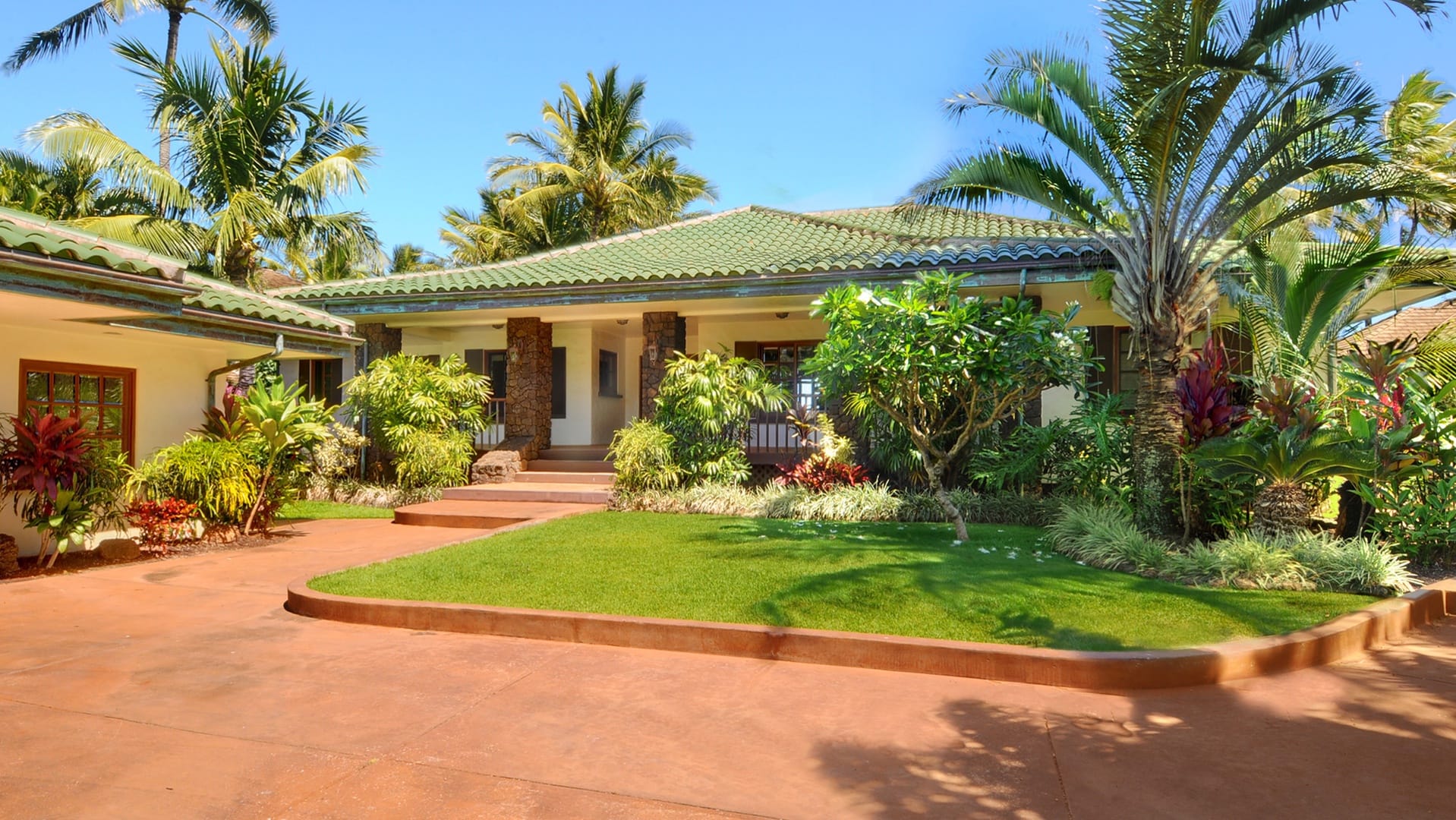 Tropical house with lush garden.