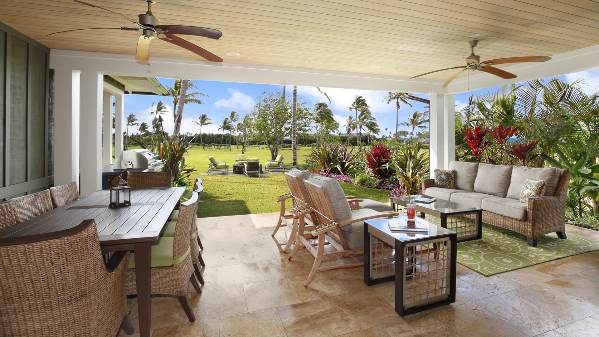 Tropical patio with outdoor furniture.