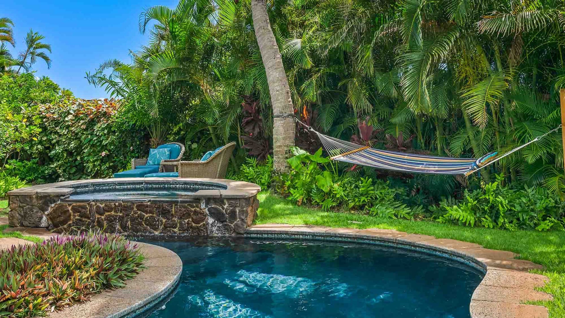 Poolside hammock and lounge chairs.