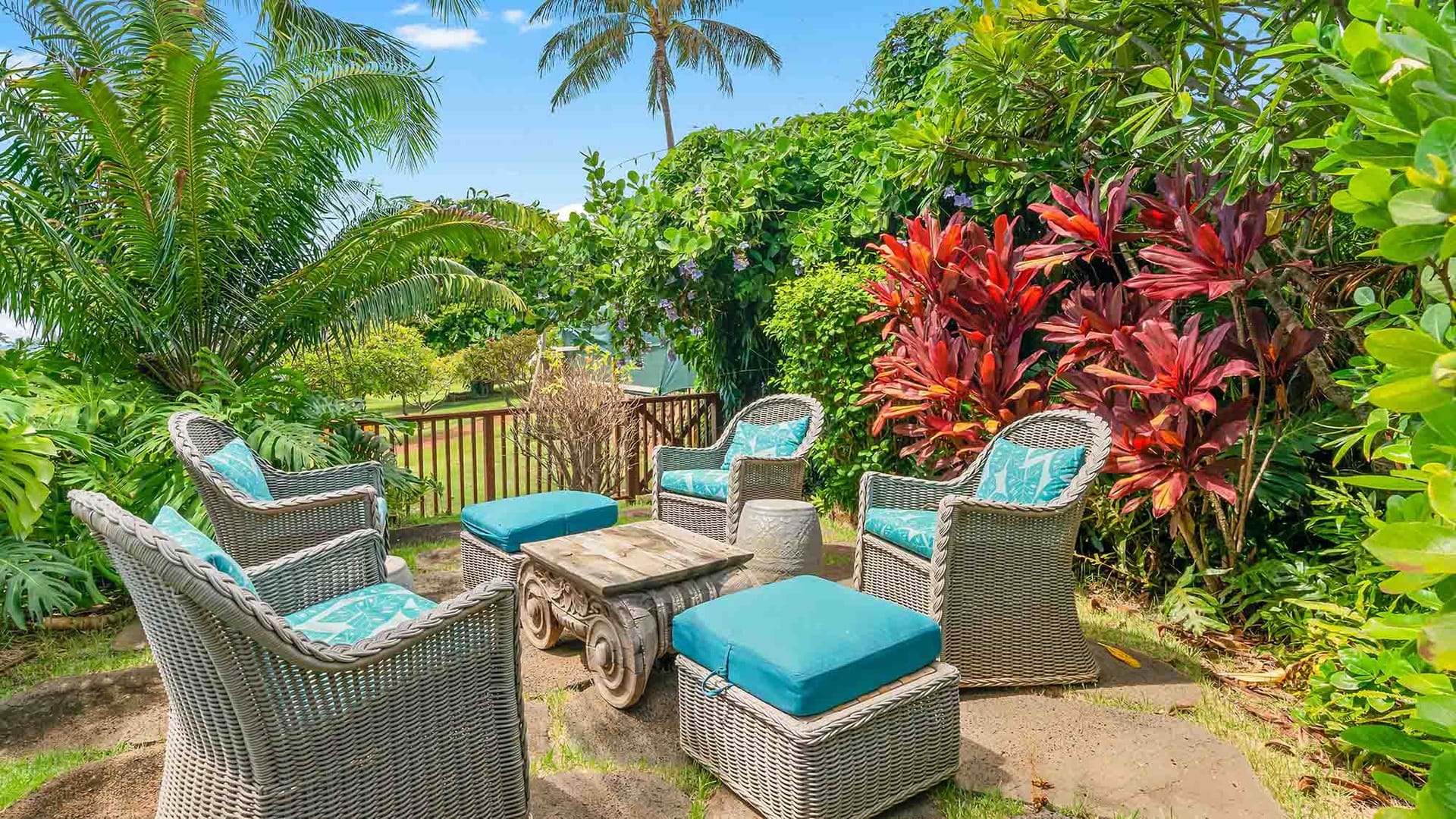 Garden patio with wicker furniture.