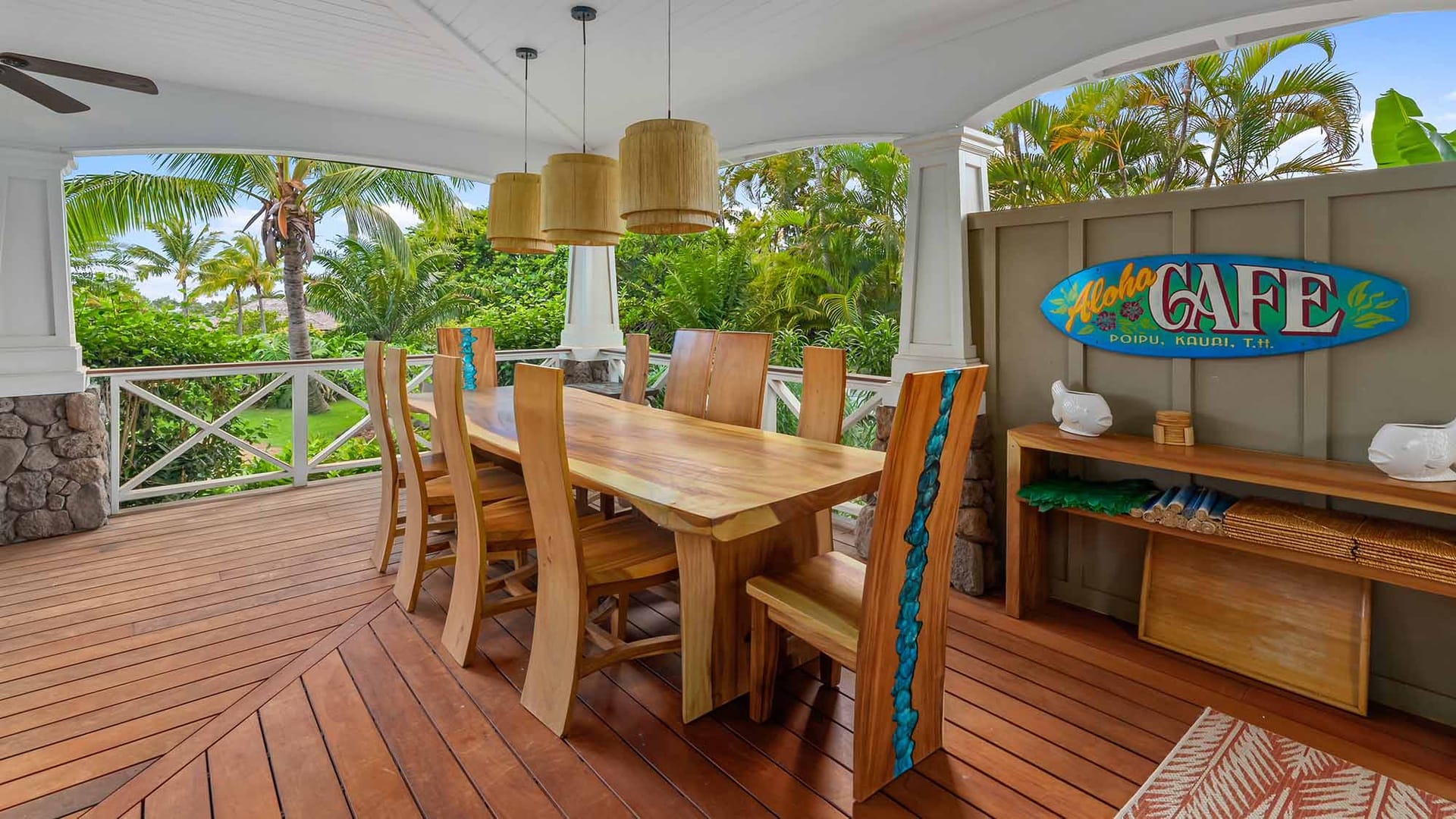 Outdoor dining area with wooden furniture.