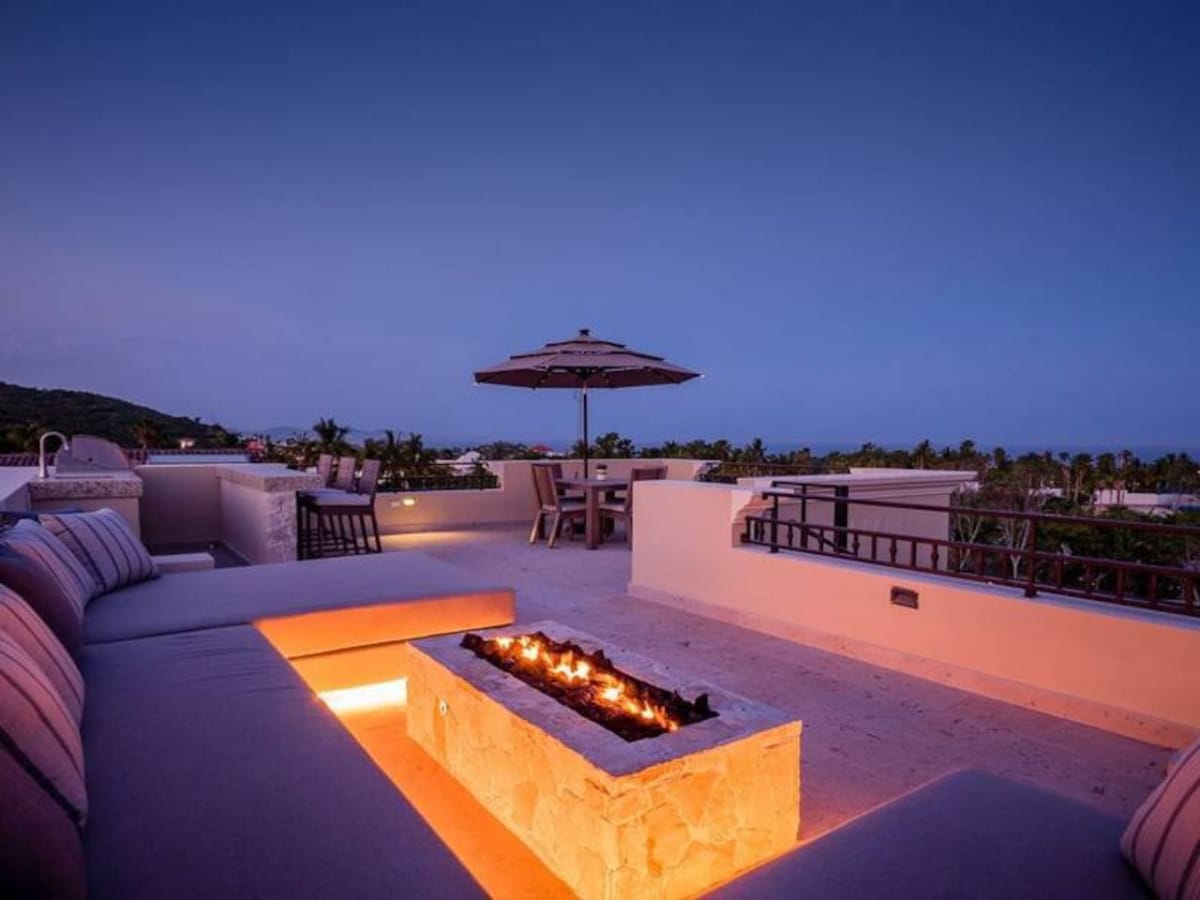 Rooftop patio with fire pit.