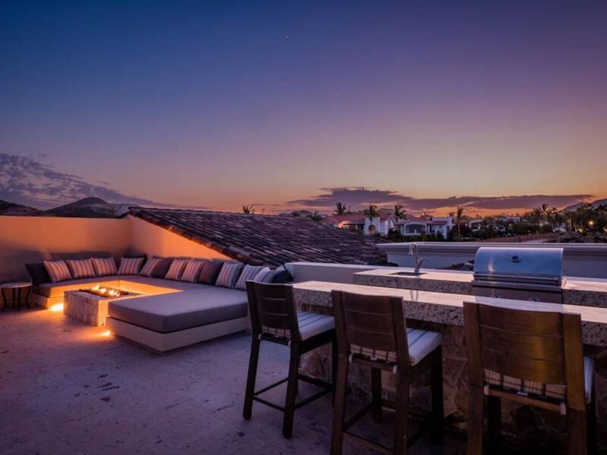 Outdoor patio with sunset view.