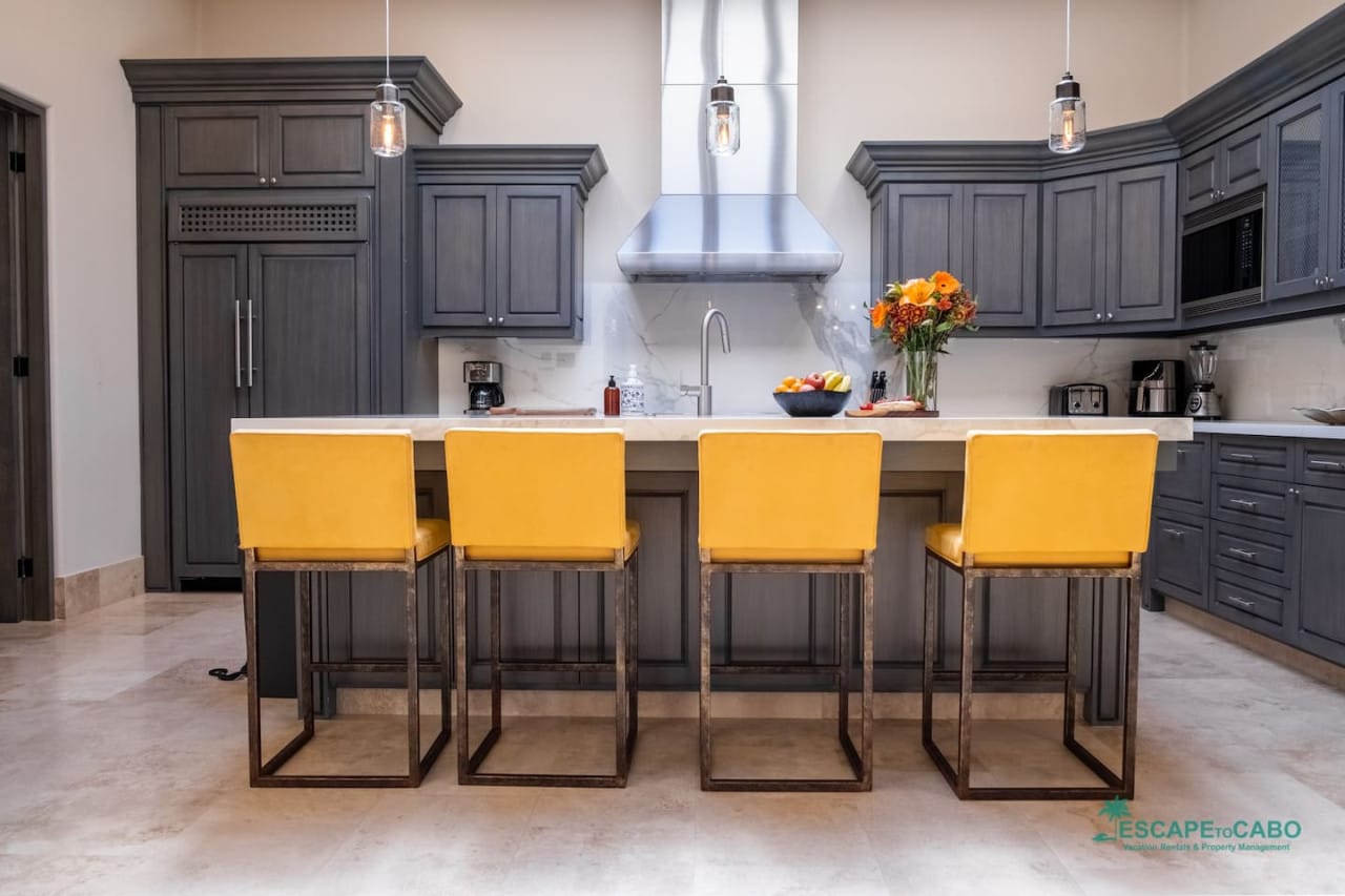 Modern kitchen with yellow chairs