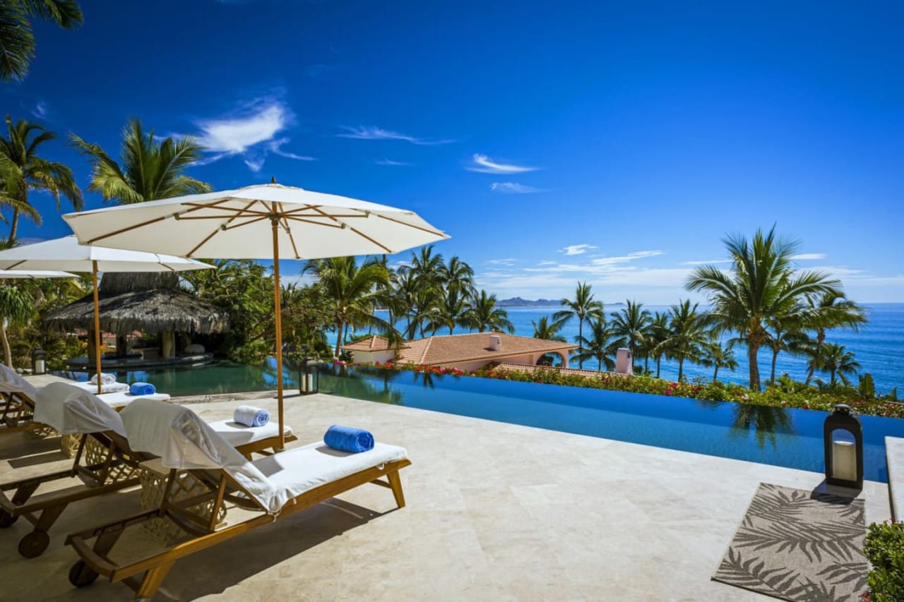 Poolside loungers with ocean view.