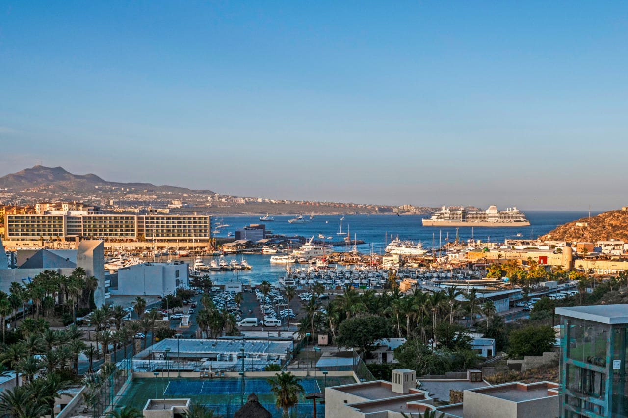 Coastal cityscape with cruise ship.