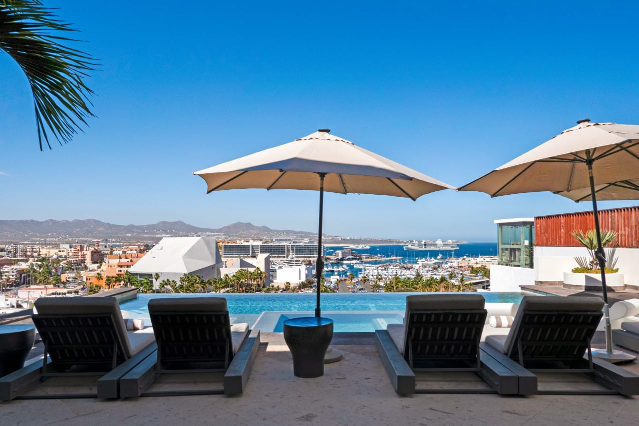 Lounge chairs by infinity pool.