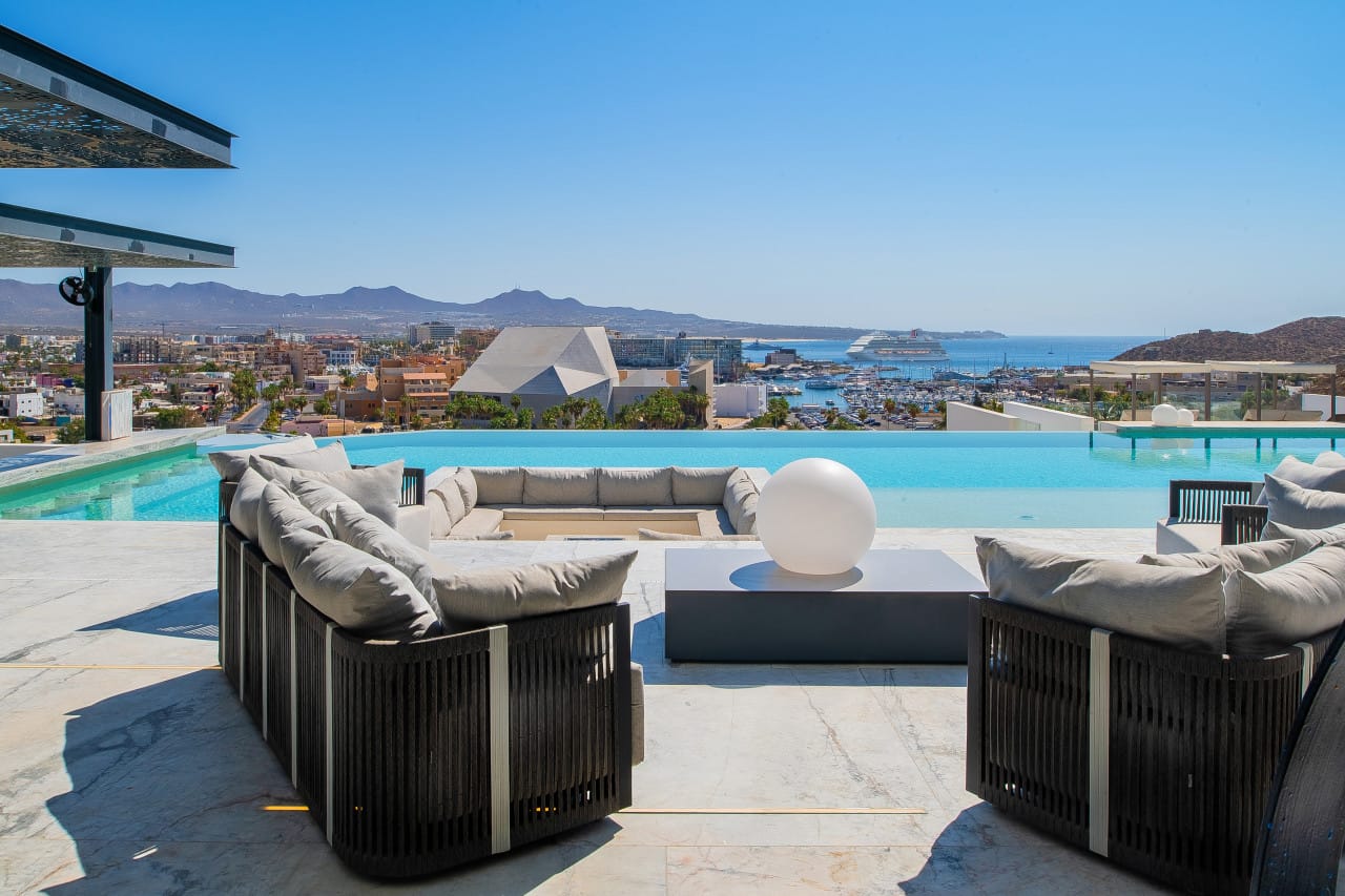 Terrace with pool overlooking city.