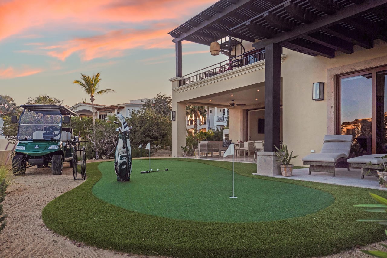 Backyard golf setup at sunset.