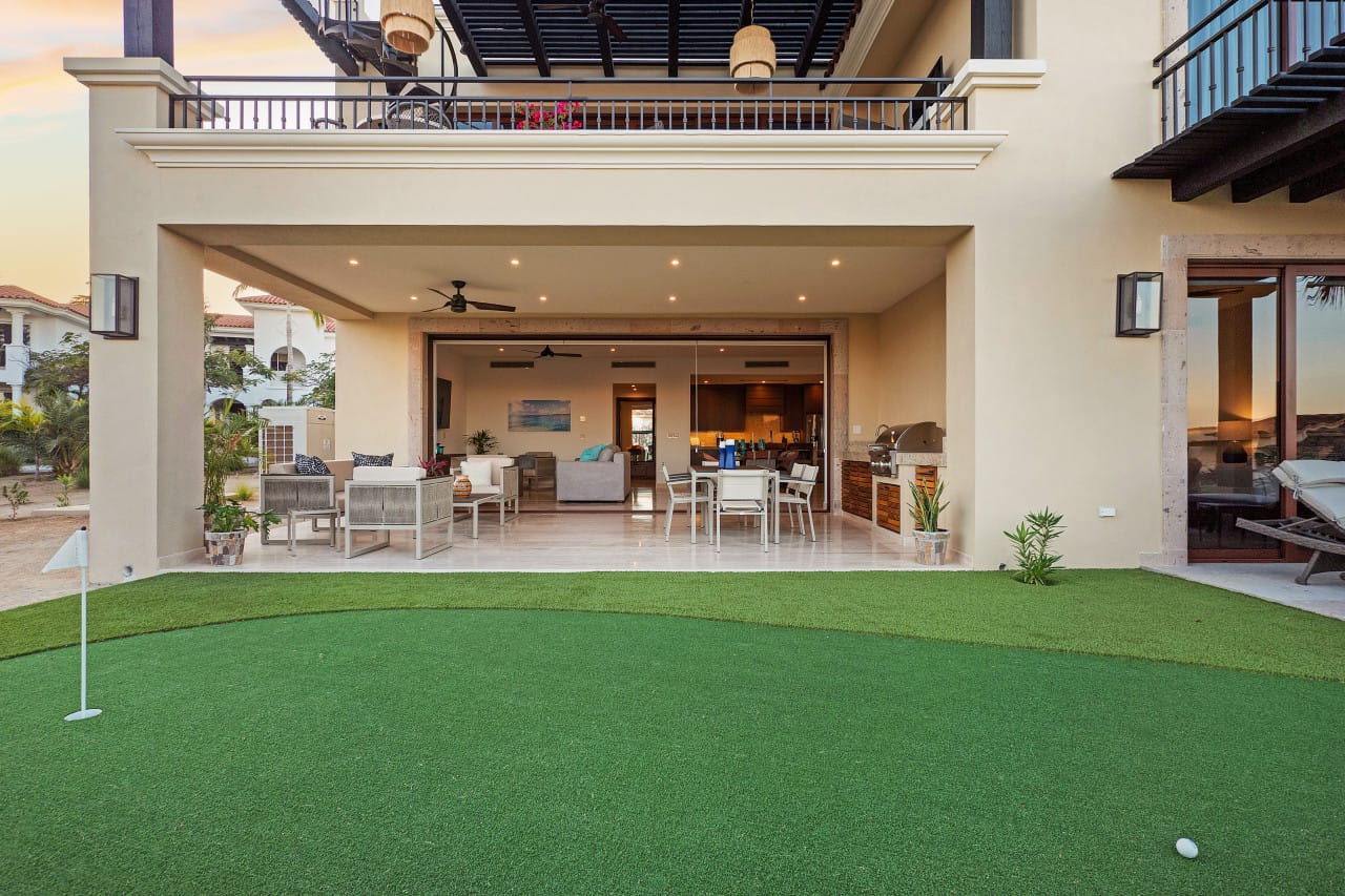 Outdoor patio with putting green.