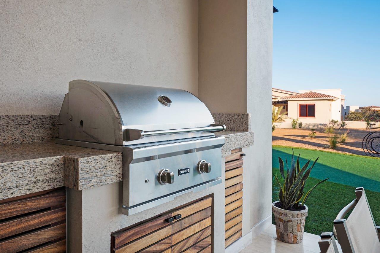 Outdoor stove with patio view.