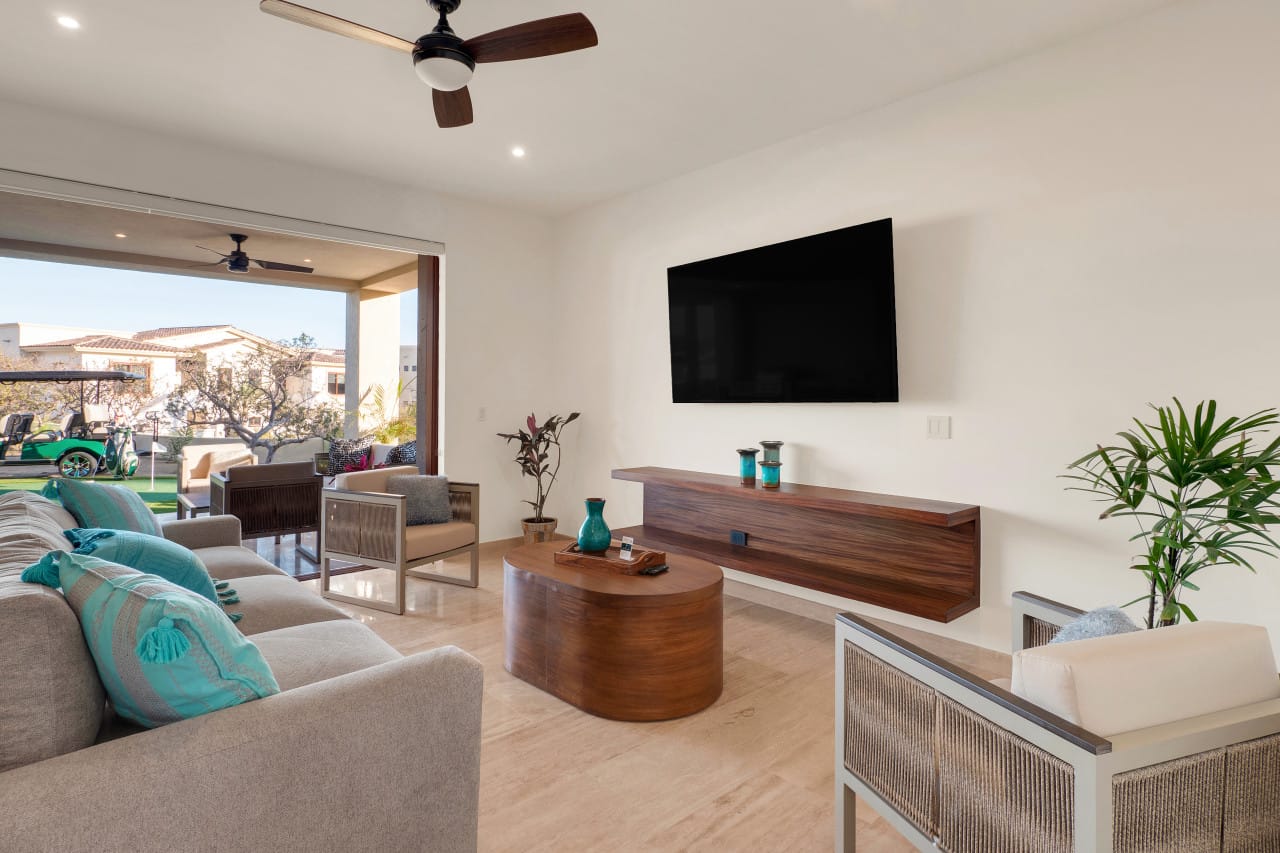 Modern living room, open patio view.