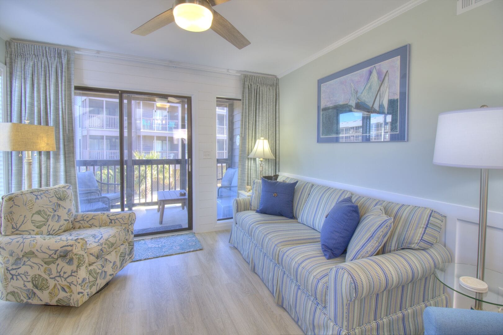 Bright living room with striped sofa.