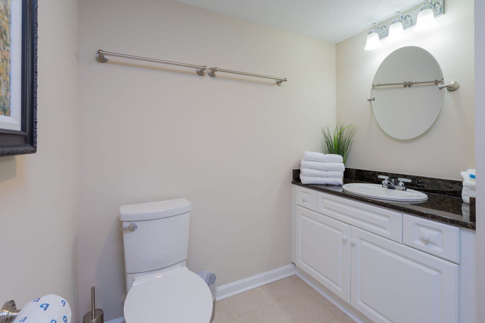 Modern bathroom with toilet, sink.