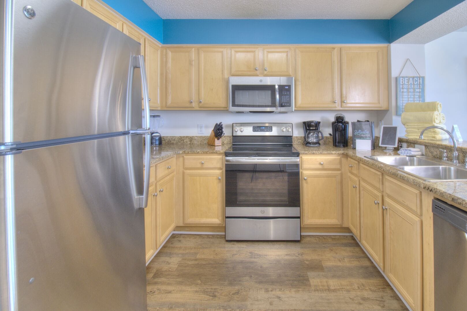 Modern kitchen with stainless appliances.