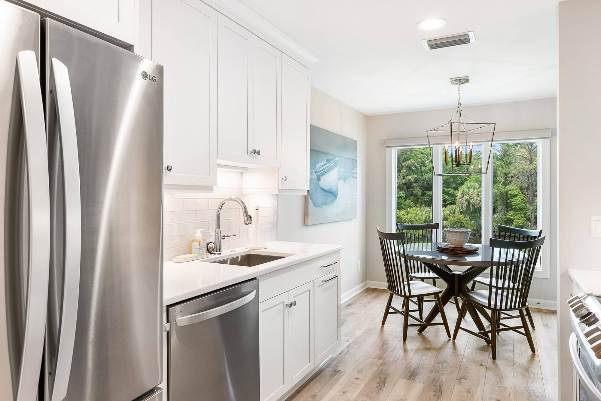 Modern kitchen with dining area.