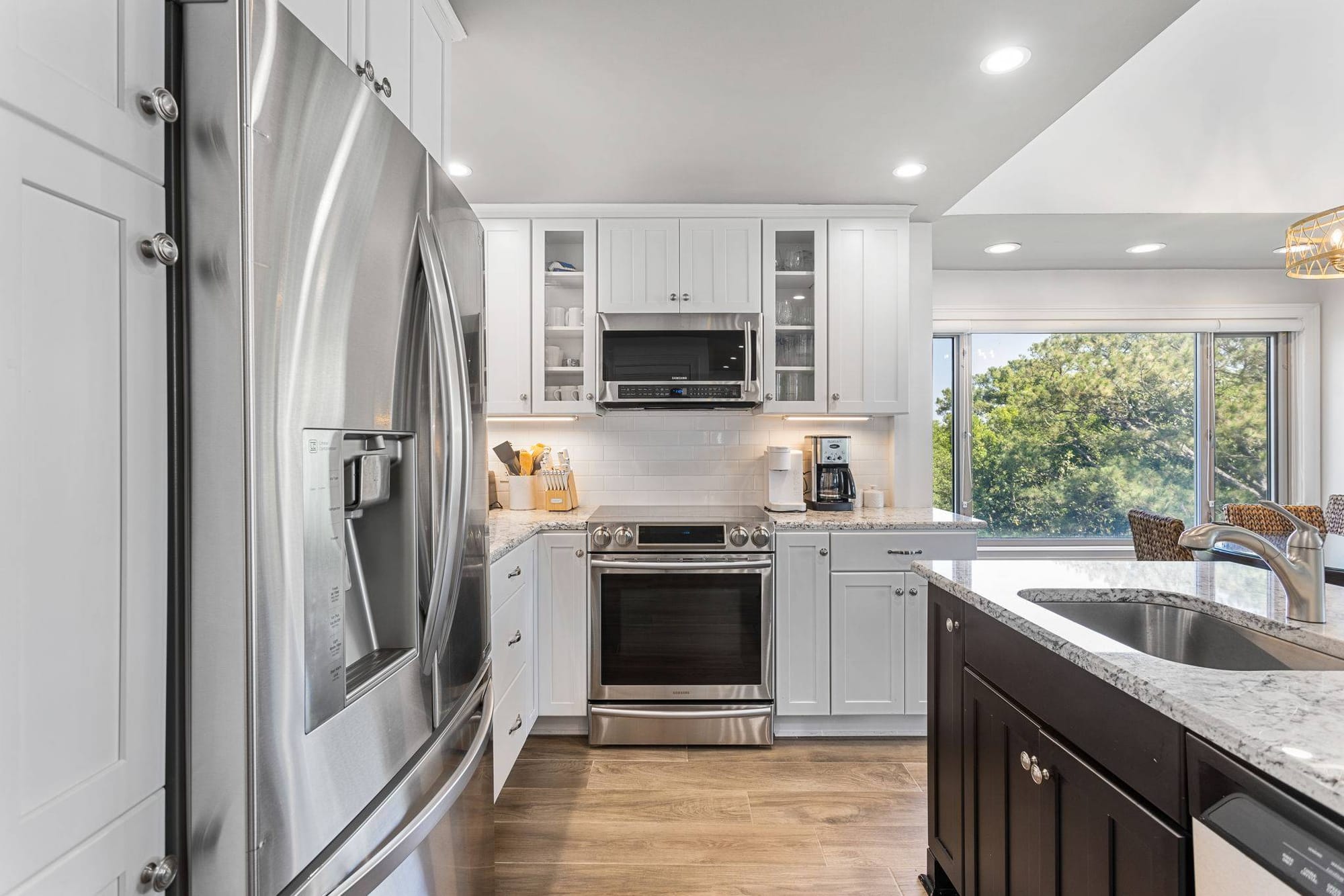 Modern kitchen with stainless steel appliances.