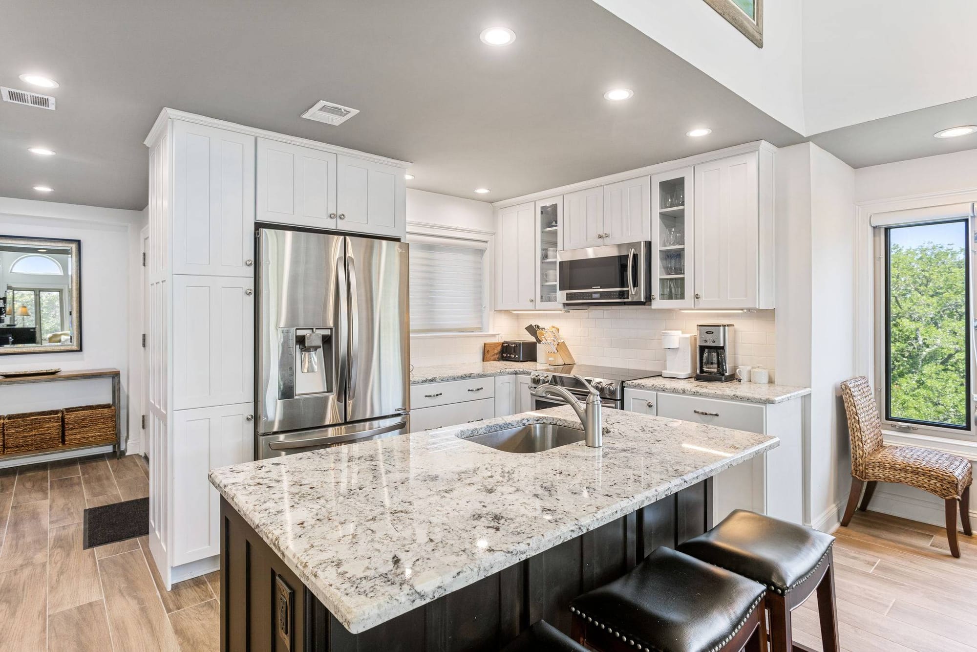 Modern kitchen with granite island.