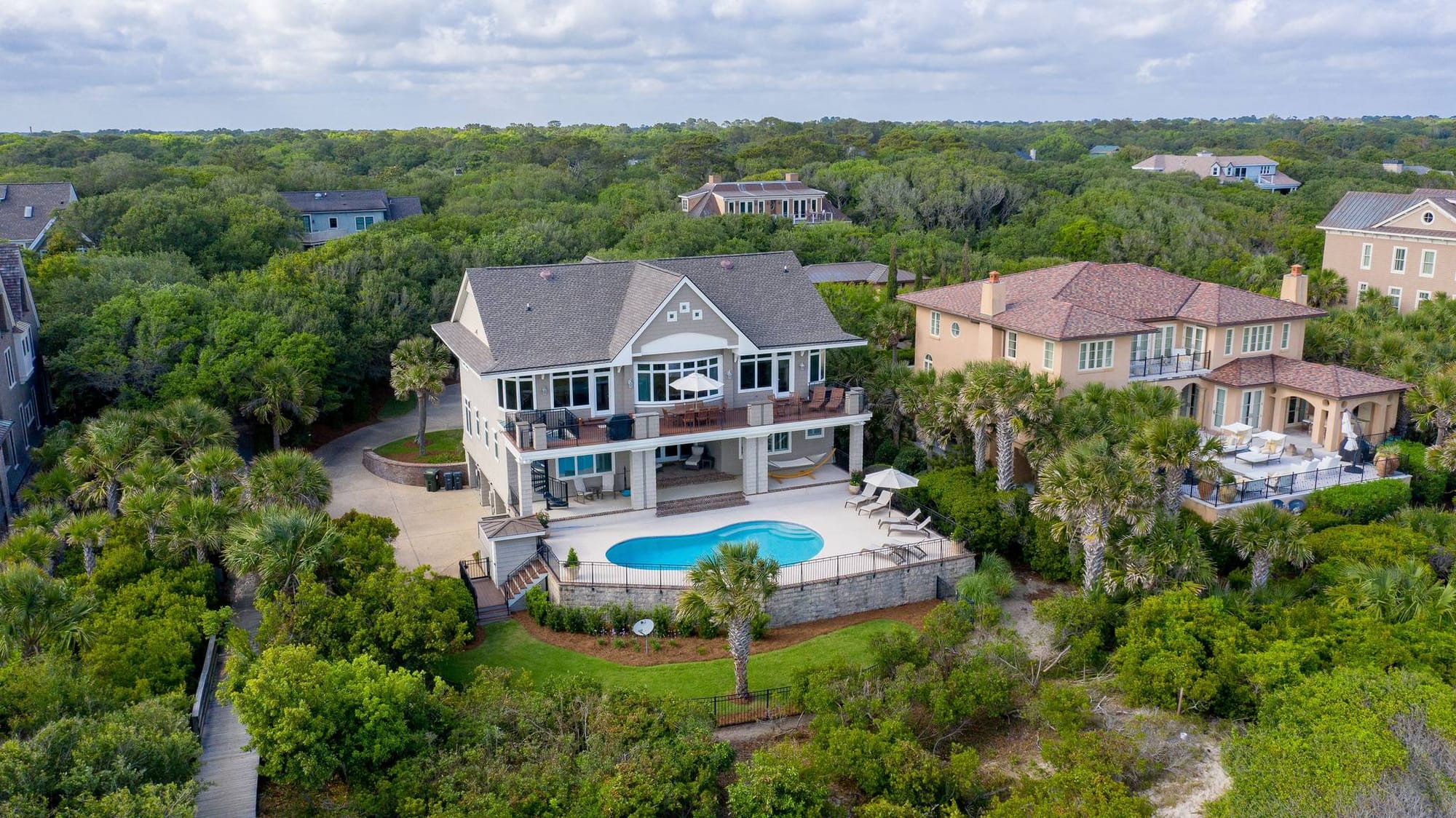 Aerial view of house with pool.