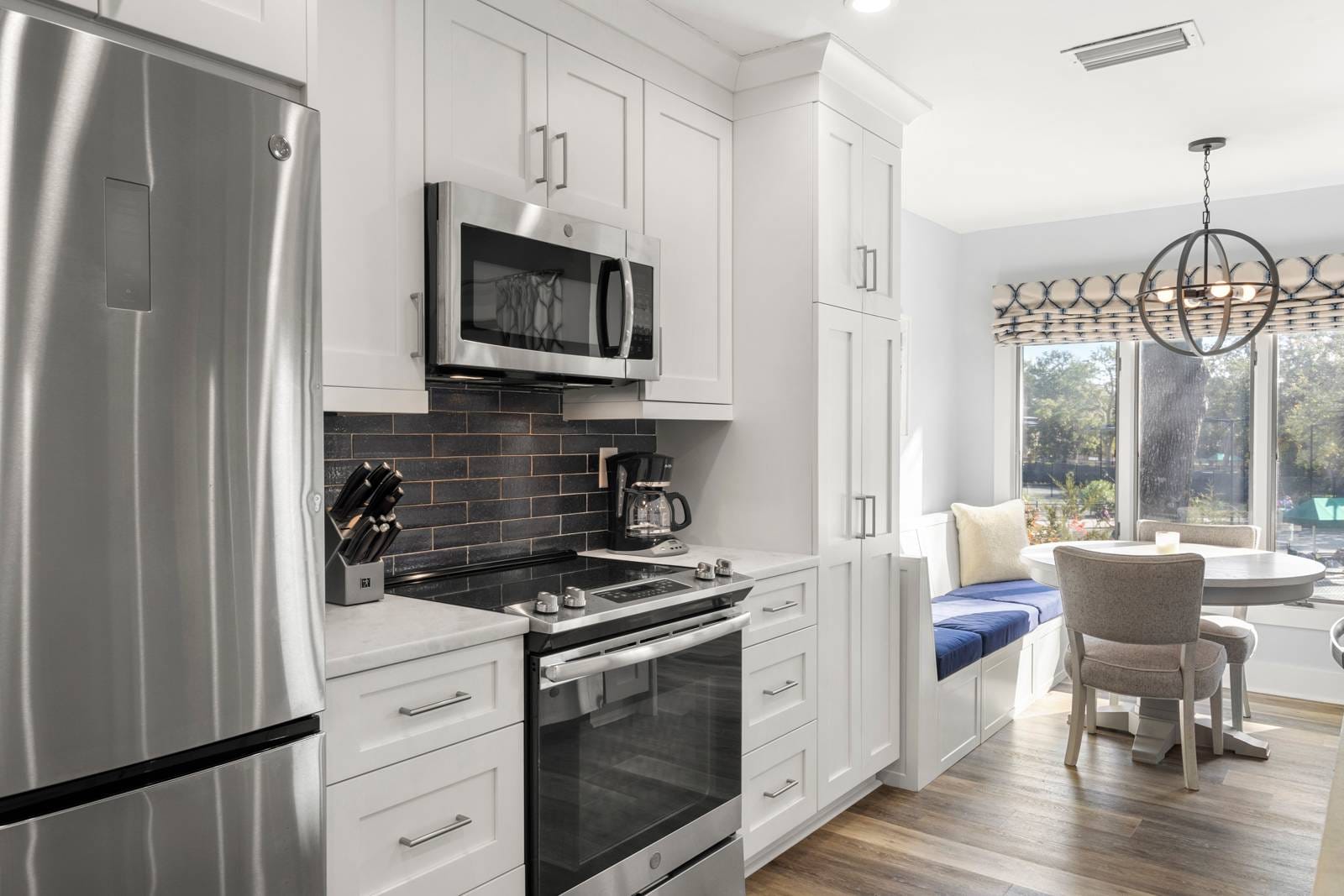 Modern kitchen with dining nook.