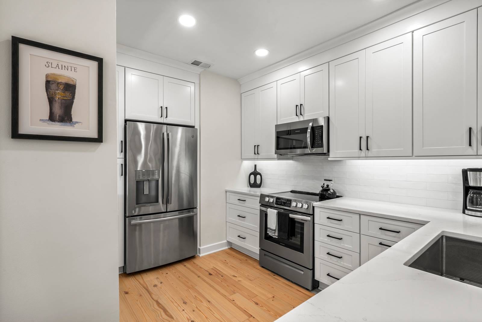 Modern kitchen with stainless steel appliances.