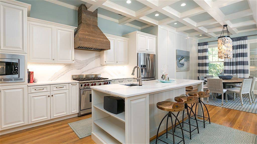 Modern kitchen with island and dining.