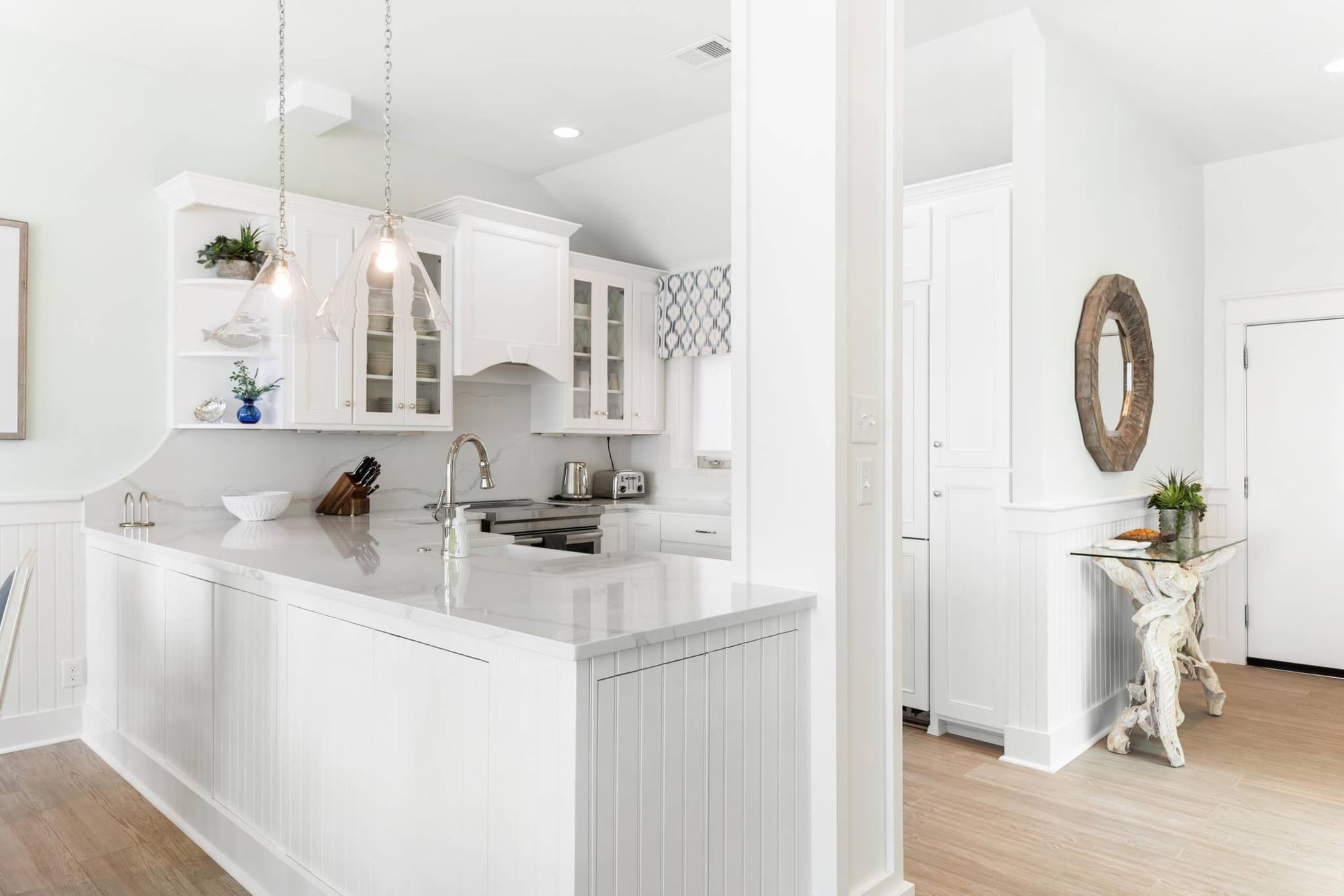 Bright, modern white kitchen interior.